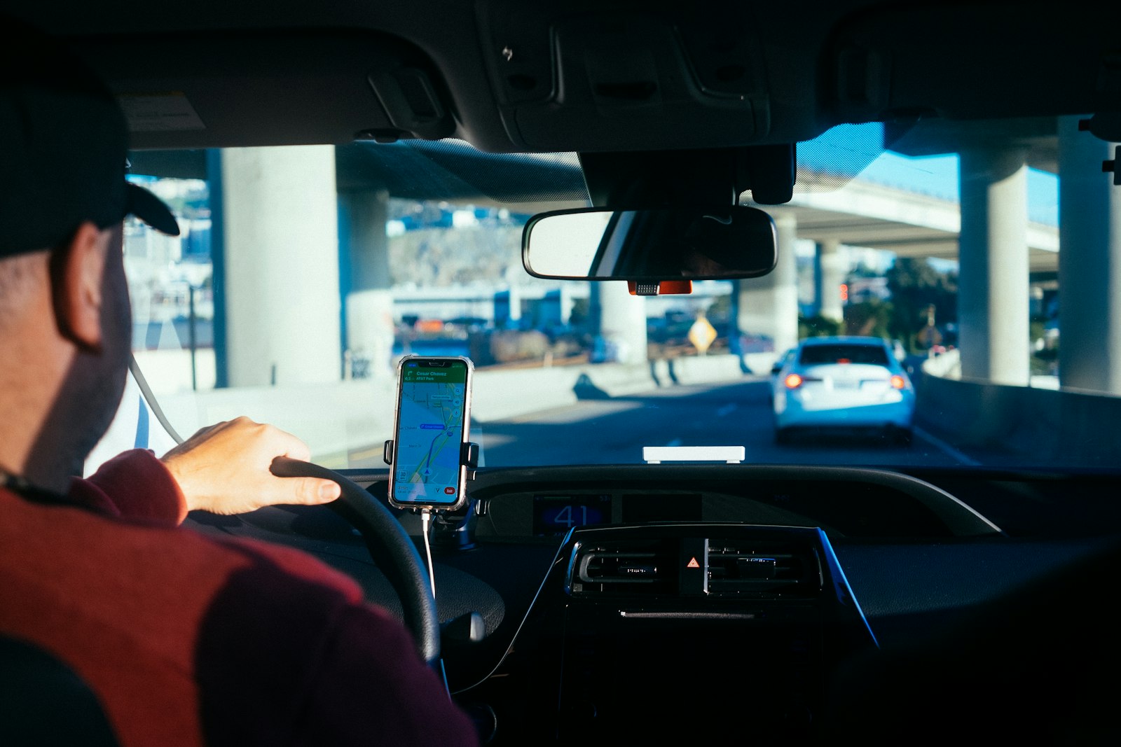 A delivery driver checking a route on a handheld device
